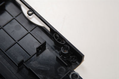 Remove crescent-shaped plastic piece