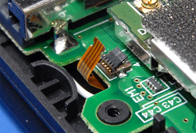 Disconnect small ribbon cable
