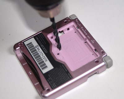 Drill consecutively larger holes until you get to 13/64