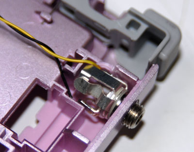 Insert jack into hole with solder tabs up