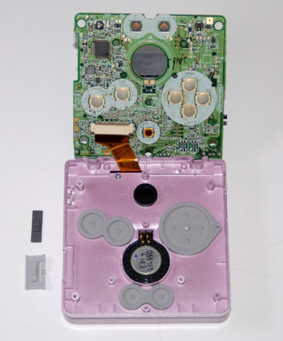 Lift PCB to reveal ribbon cable